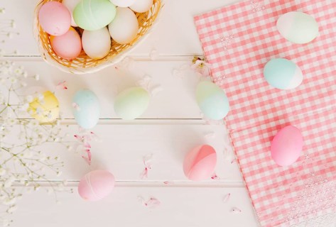 Set easter eggs flower petals near napkin basket