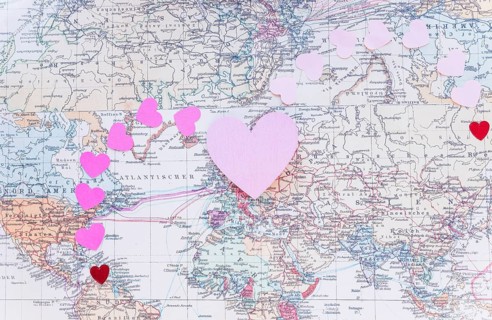 Small colourful paper hearts world map