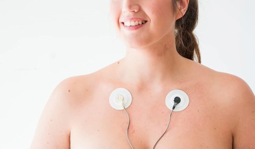 Smiling female with electrodes body