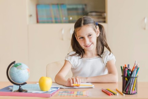 Smiling girl looking away during lesson