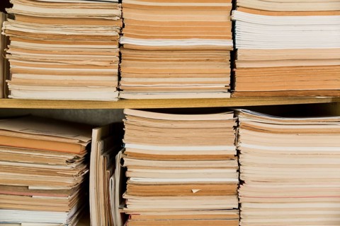 Stacked old notepads shelf