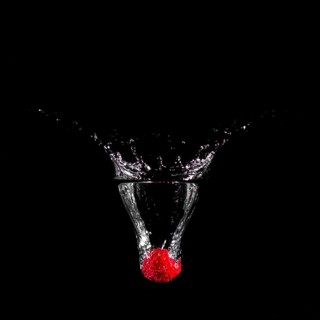 Strawberry plunging into water