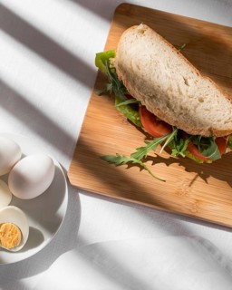 Toast sandwich with tomatoes greens hard boiled eggs