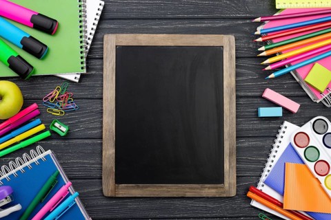 Top view back school stationery with colorful pencils blackboard