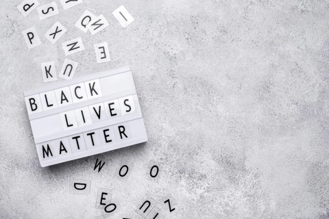 Top view black lives matter light box with letters copy space