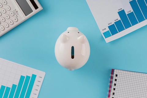 Top view business items with piggy bank growth chart