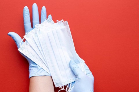 Top view hands holding medical masks