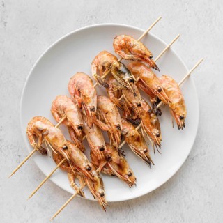 Top view plate with shrimp skewers