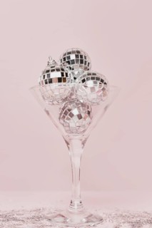 Transparent champagne glass with silver balls