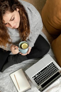 Woman home using laptop