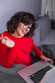 Woman red using laptop
