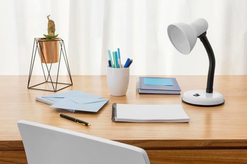 Workspace composition with desk lamp
