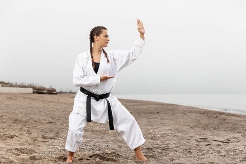 Young girl karate costume exercising