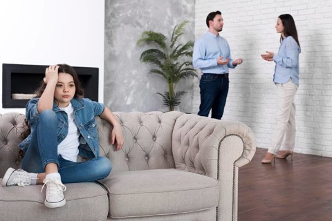 Young girl tired parents arguing