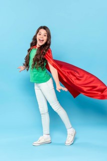 Young girl with hero costume