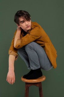 Young man wearing shirt posing chair 2