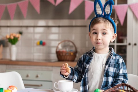 Adorable little boy with bunny ears posing