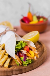 Arabic kebab sandwich wrapped white paper high view