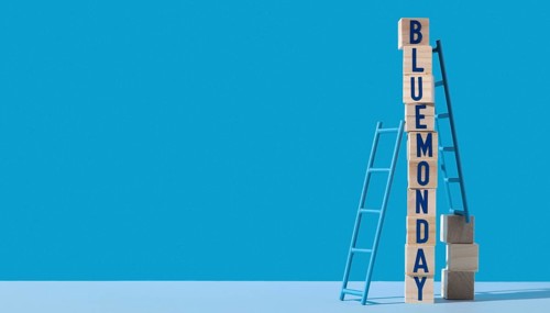 Blue monday with wooden cubes ladders copy space
