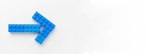 Blue toy arrow with copy space