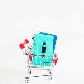 Blue turquoise cassette tapes shopping cart isolated white background