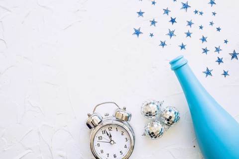 Bottle with clock spangles white table