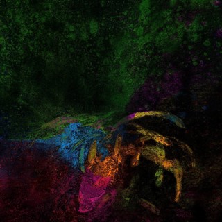 Bright rangoli colors spread black surface