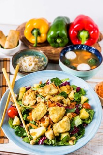 Chicken salad with chopsticks beans sprout fish ball soup table