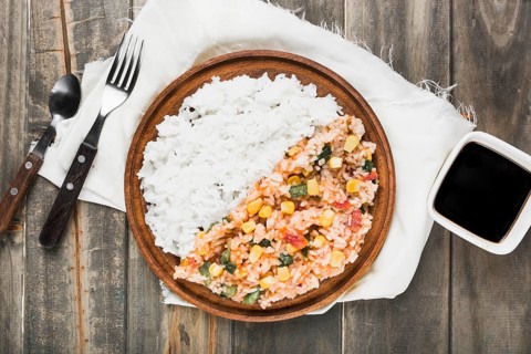Chinese fried steamed rice wooden plate with soya sauce table