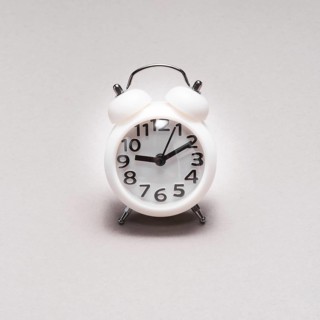 Close up alarm clock plain background