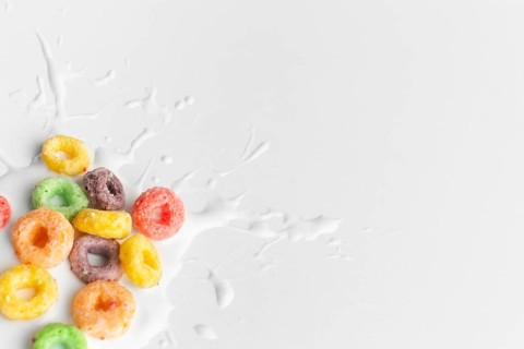 Close up colorful cereal with splash milk