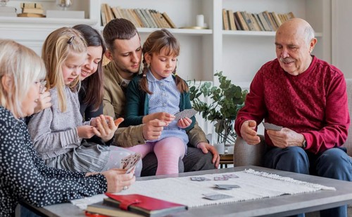 Close up family members playing games