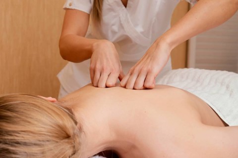Close up hands massaging back