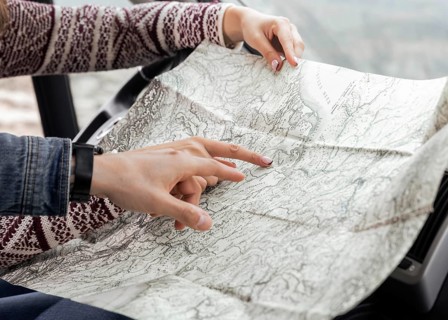 Close up hands pointing map
