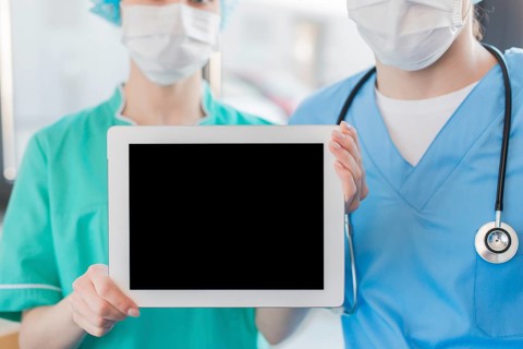 Close up nurses holding chalkboard