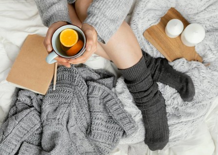 Close up woman bed drinking tea