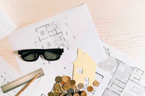 Coins house with glasses