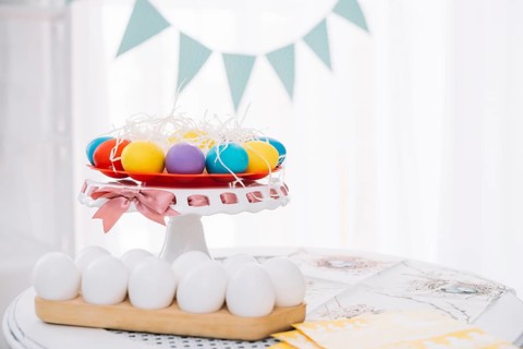 Colorful easter eggs with white eggs table home