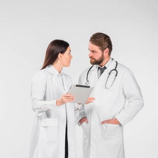 Doctors female male discussing looking each other