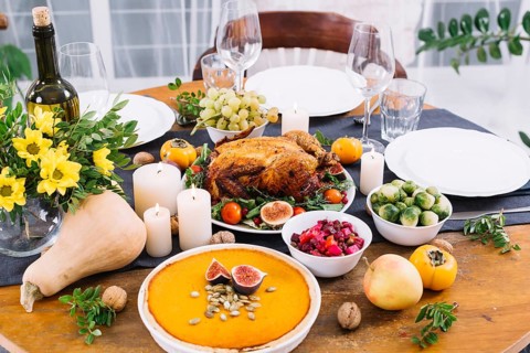 Festive table with baked chicken vegetables