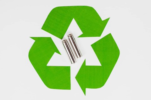 Green eco recycle symbol used batteries