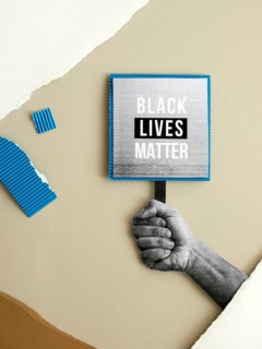 Hand holding black lives matter sign