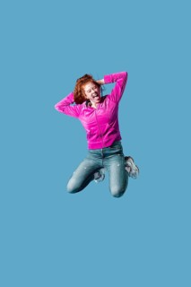 Happy young woman jumping 16