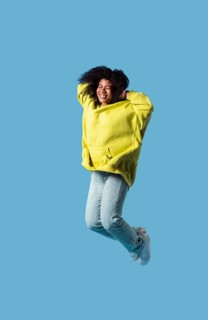 Happy young woman jumping 17