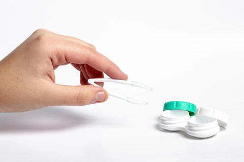 High angle hand holding tweezers contact lenses