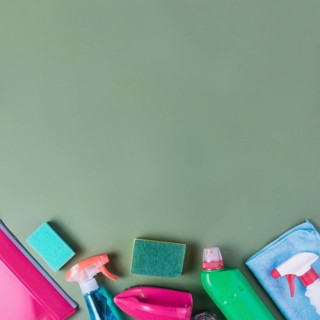High angle view cleaning supplies green background