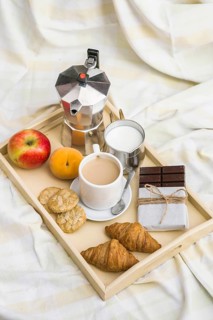High angle view healthy breakfast messy bedsheet