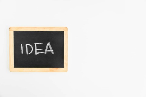 Idea text written slate white background