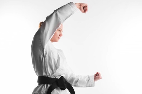 Karate fighter posing side view