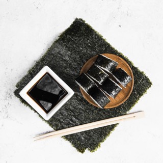 Lay out sushi rolls chopsticks sauce